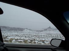 Driving through Monument Valley in fog and snow